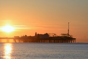a sunset over a pier