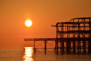 a sunset over a pier